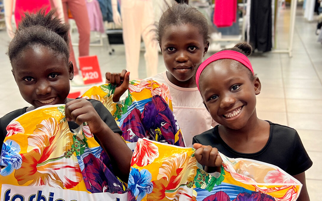 orphan girls in Zambia shopping at the mall