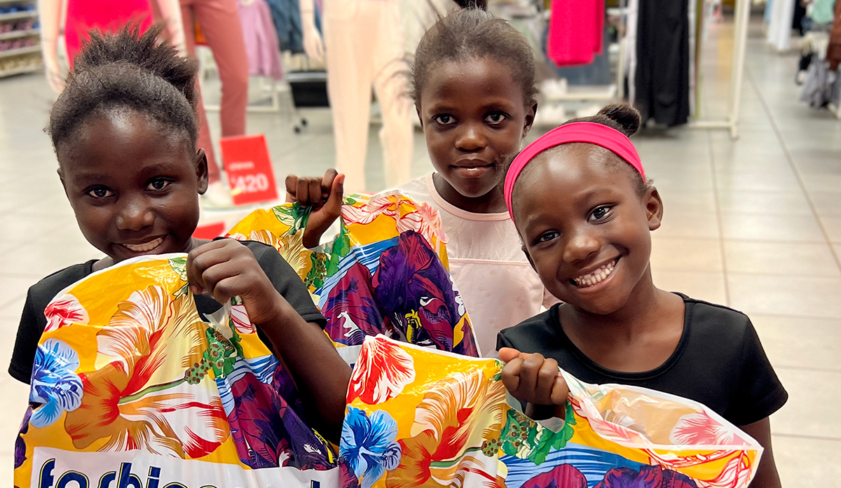 orphan girls in Zambia shopping at the mall